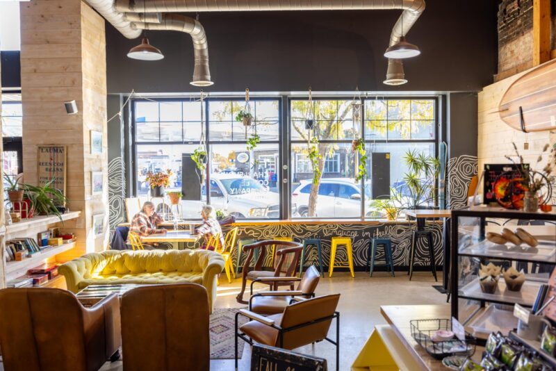 inside Lake Charlevoix Coffee Co in Downtown Boyne City - light shines in through the window creating a warm atmosphere