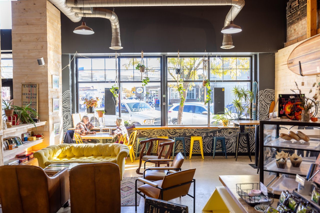 inside Lake Charlevoix Coffee Co in Downtown Boyne City - light shines in through the window creating a warm atmosphere