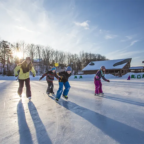 A group of kids ice skating